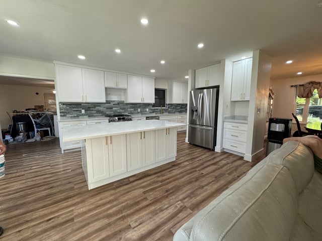 Kitchen remodel with gold hardware, vinyl plank flooring and recessed lighting
